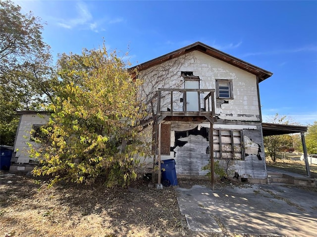 rear view of house with a carport