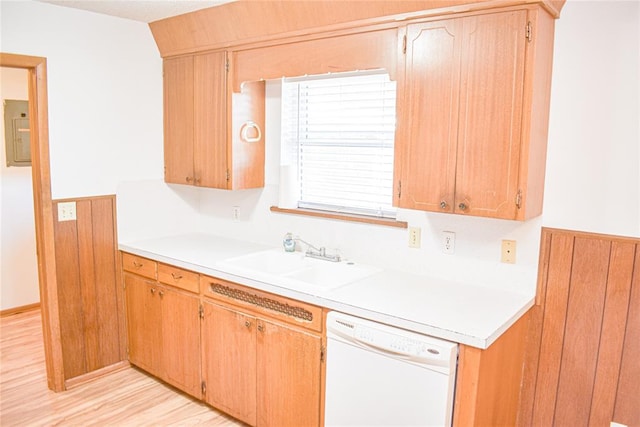 kitchen with electric panel, dishwasher, light hardwood / wood-style floors, and sink