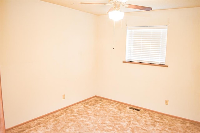 unfurnished room featuring carpet and ceiling fan