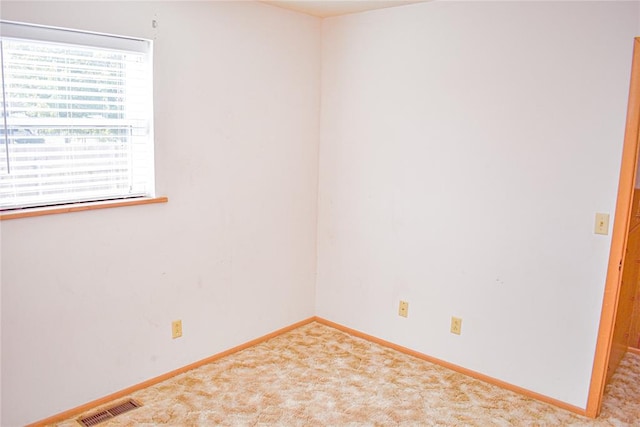 empty room with carpet flooring