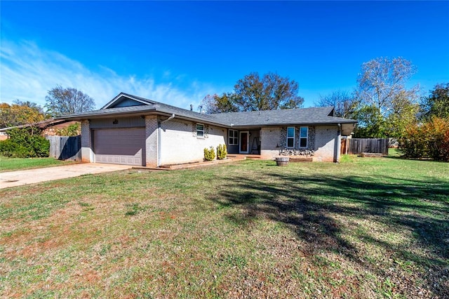 ranch-style house with a front lawn and a garage