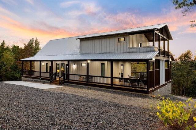 view of back house at dusk