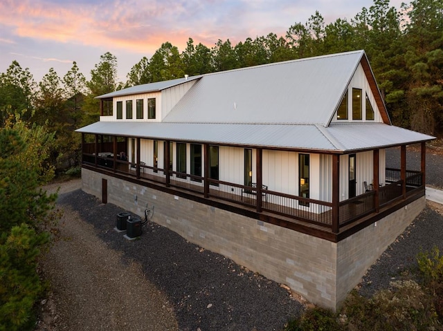 view of back house at dusk