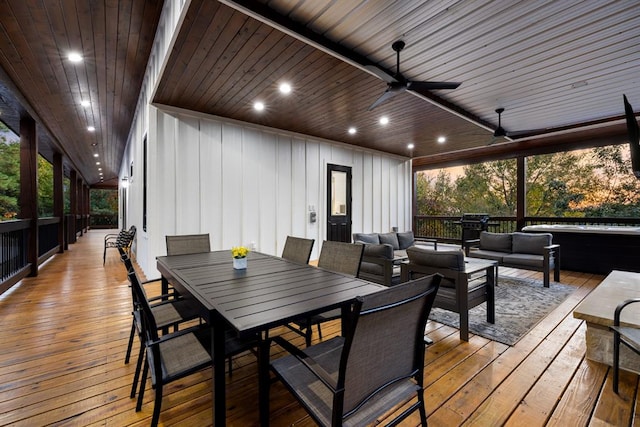 deck featuring ceiling fan and an outdoor living space