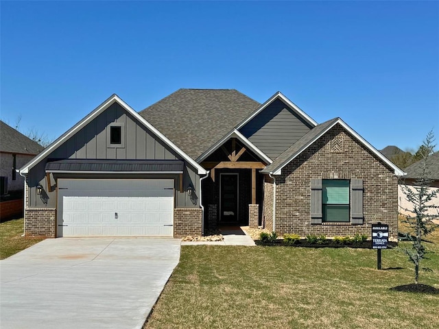 view of front of property with a garage and a front yard