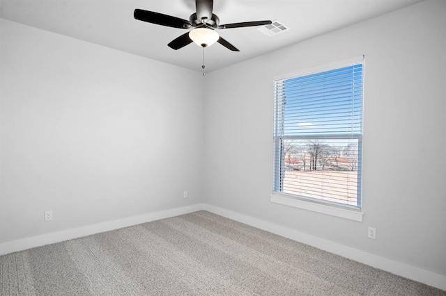 spare room with ceiling fan and carpet floors