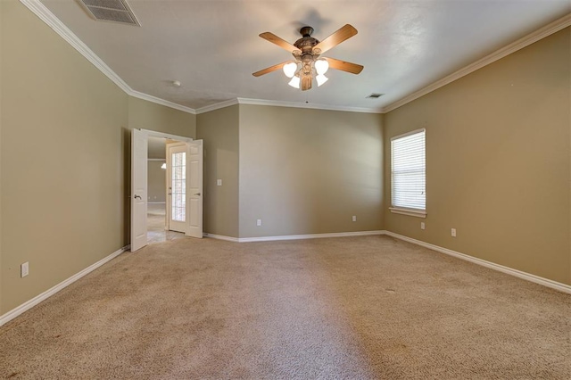 spare room with light carpet, ceiling fan, and ornamental molding