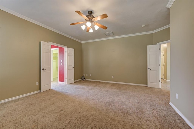 unfurnished bedroom featuring ceiling fan, ornamental molding, and light carpet