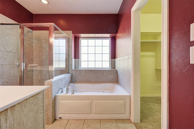 bathroom featuring tile patterned flooring and plus walk in shower