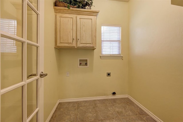 washroom featuring tile patterned floors, electric dryer hookup, cabinets, and hookup for a washing machine