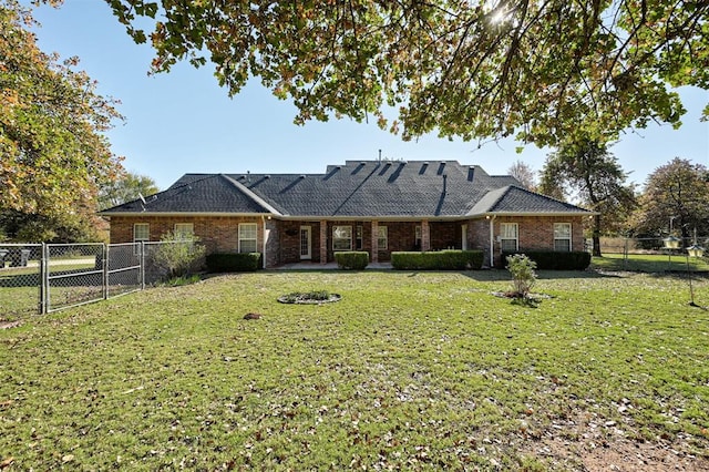 back of property featuring a yard