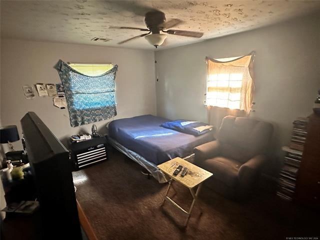 bedroom featuring ceiling fan and carpet floors