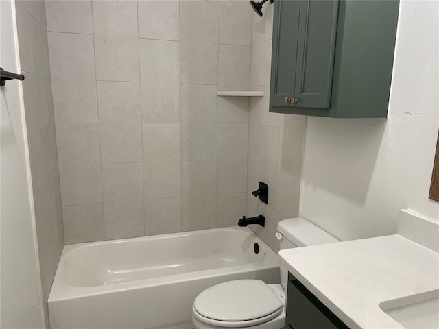 bathroom featuring bathtub / shower combination, vanity, and toilet