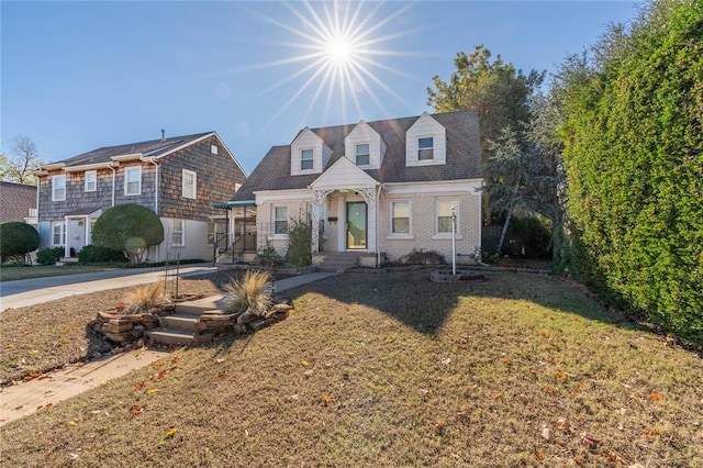 new england style home with a front yard