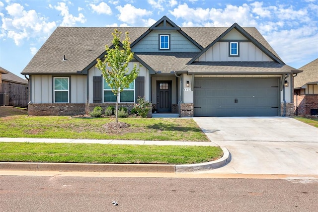 craftsman inspired home with central AC, a garage, and a front lawn