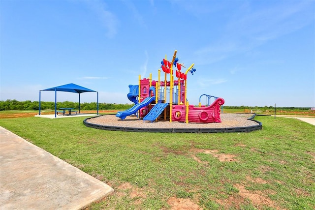 view of jungle gym featuring a lawn