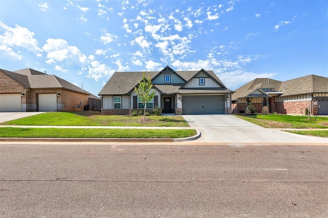 view of front of property featuring a garage and a front yard