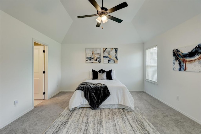 bedroom featuring ceiling fan, light carpet, and lofted ceiling