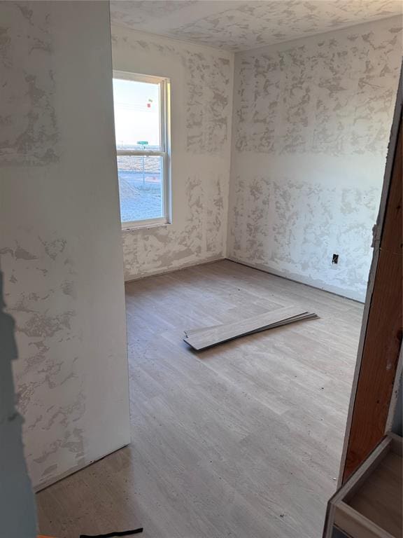 spare room with hardwood / wood-style floors