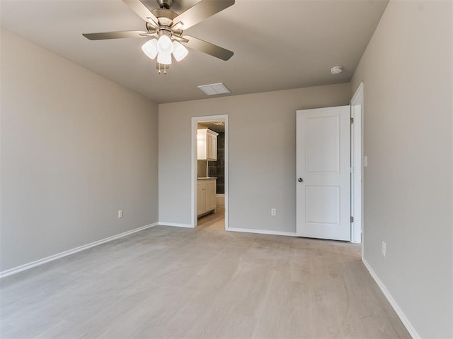 unfurnished bedroom with a ceiling fan, light wood-type flooring, baseboards, and ensuite bathroom