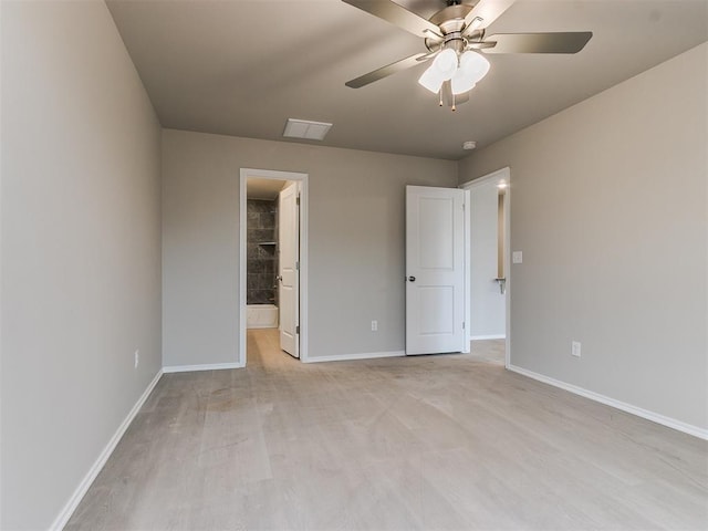 unfurnished bedroom with light wood-type flooring, visible vents, and baseboards