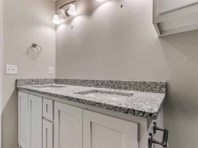 bathroom featuring double vanity