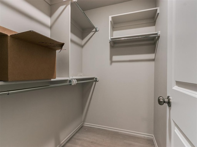 spacious closet with wood finished floors