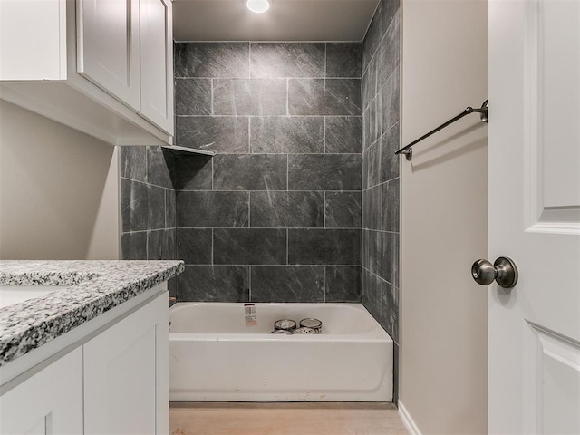 bathroom with vanity and bathing tub / shower combination