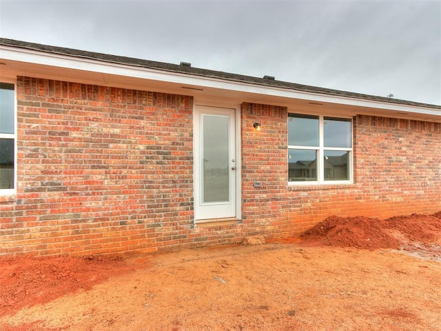 exterior space featuring brick siding