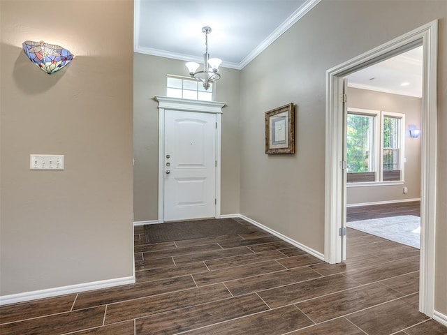 entrance foyer featuring crown molding and a notable chandelier