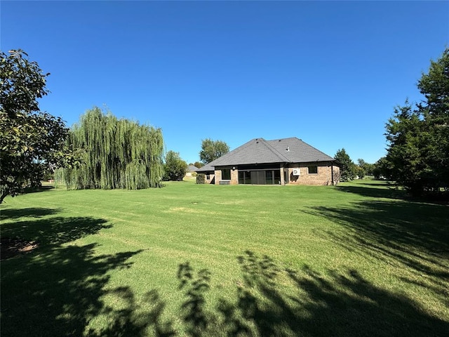 view of yard with a sunroom