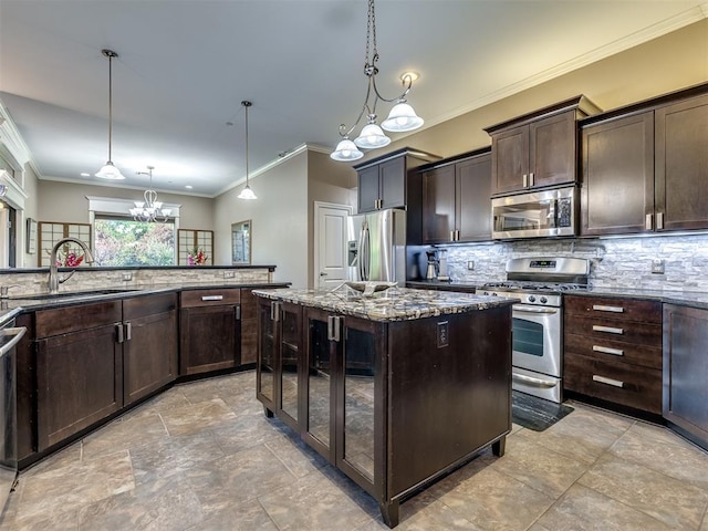 kitchen with stainless steel appliances, a sink, dark brown cabinets, backsplash, and dark stone countertops