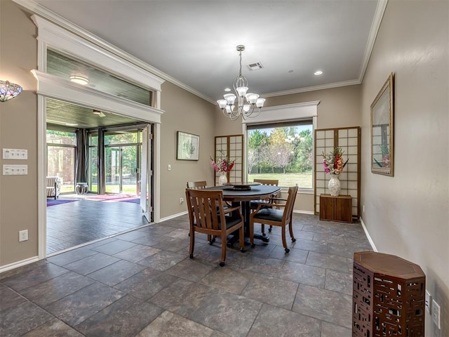 dining room with a wealth of natural light, stone tile flooring, visible vents, and baseboards