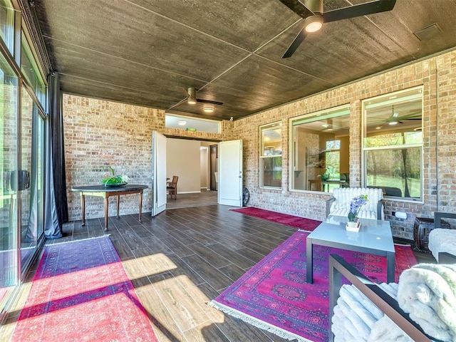 wooden deck with a ceiling fan and an outdoor living space