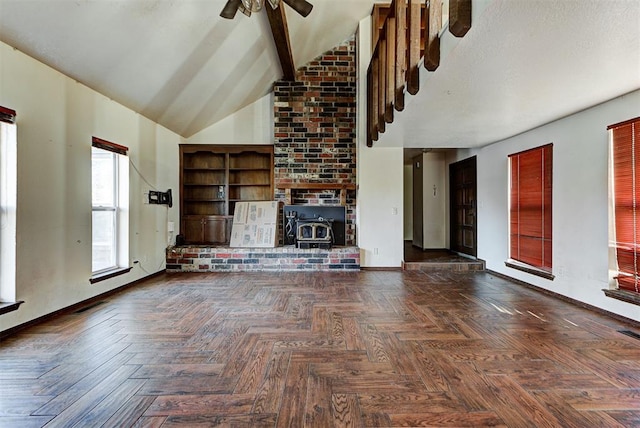 unfurnished living room with a wood stove, high vaulted ceiling, dark parquet floors, ceiling fan, and beamed ceiling