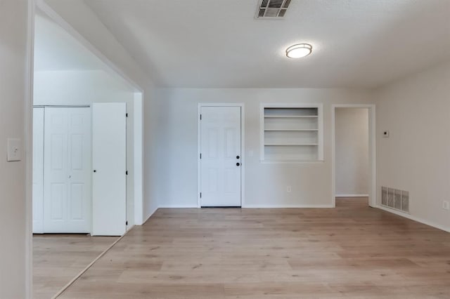 entrance foyer featuring light hardwood / wood-style floors