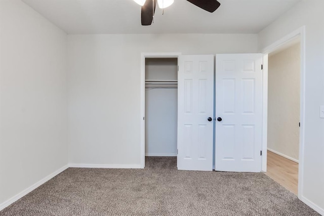 unfurnished bedroom with a closet, ceiling fan, and carpet flooring