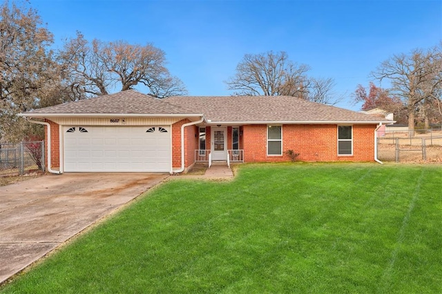 ranch-style house with a garage and a front yard