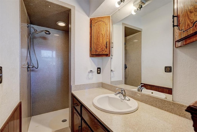 bathroom featuring vanity and walk in shower