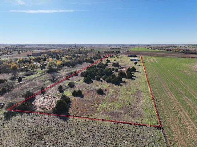 birds eye view of property featuring a rural view