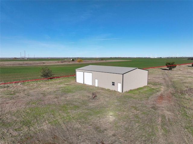 view of outbuilding featuring a rural view