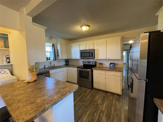 kitchen with kitchen peninsula, stainless steel appliances, and white cabinetry