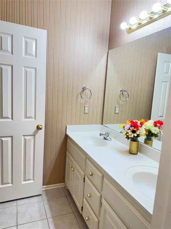 bathroom featuring tile patterned flooring and vanity