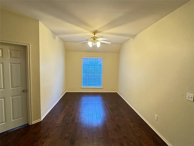 unfurnished room with dark hardwood / wood-style floors, ceiling fan, and lofted ceiling