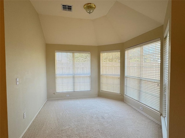 unfurnished sunroom with a healthy amount of sunlight and lofted ceiling