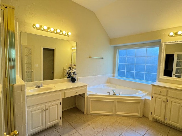 bathroom with tile patterned flooring, shower with separate bathtub, vanity, and lofted ceiling