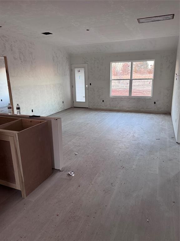 unfurnished living room with light wood-type flooring