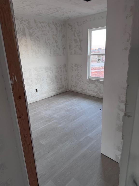 empty room featuring wood-type flooring