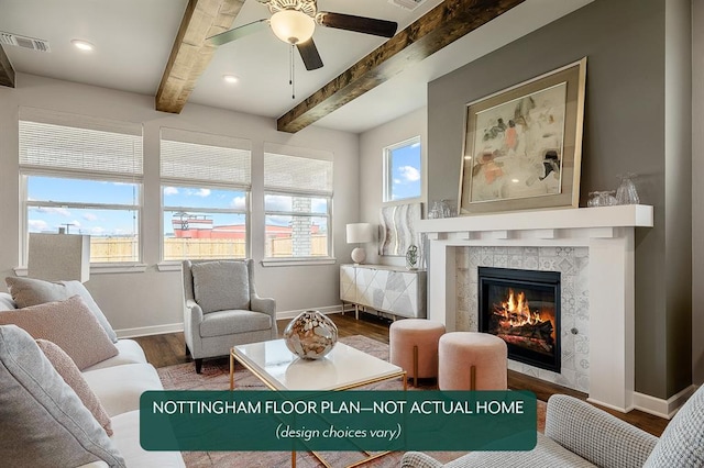 living area featuring a fireplace, wood-type flooring, a wealth of natural light, and beam ceiling