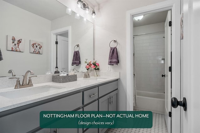 bathroom featuring tile patterned flooring, vanity, and tiled shower / bath